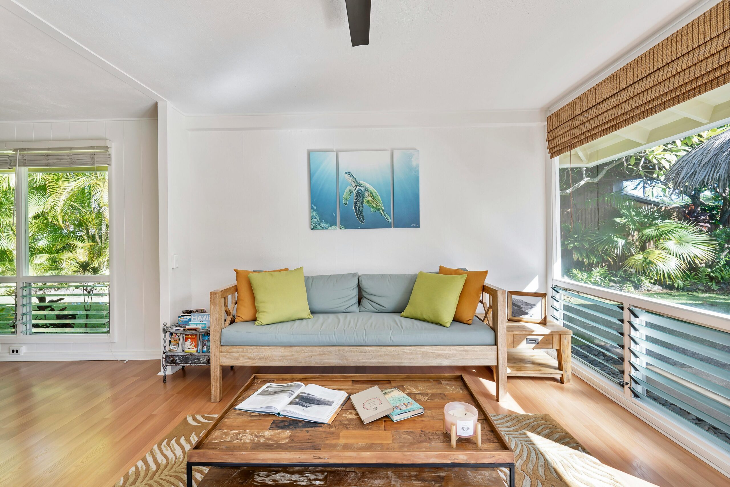 Stylish living room with natural light and nature view, perfect for relaxation.